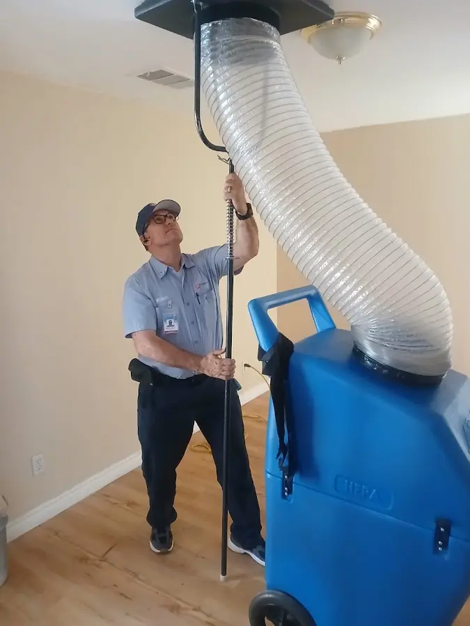 Furnace Tune-Up technician using HEPA equipment in Zephyrhills